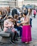 Florence, Italy - October 31st, 2017: Gypsie woman successfully begs tourists in front of the Florence Cathedral in Tuscany, Italy