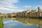 Florence, Ponte Veccio Bridge and colorful houses reflecting on River Arno