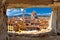 Florence square and cathedral di Santa Maria del Fiore or Duomo view through stone window