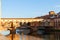 Florence town and the Ponte Vecchio bridge at sunset the Arno ri