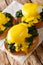 Florentine eggs is a delicious healthy breakfast of poached eggs with spinach and hollandaise sauce on a crispy bun close-up.