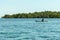 Flores/Indonesia 20290808: A fisherman`s boat crossing a calm sea near Maumere, Indonesia There is one man in the boat, wearing