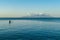 Flores/Indonesia 20290808: A fishermen`s boat crossing a calm sea near Maumere, Indonesia There are three men in one small, blue