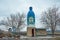 Floresti, Moldova - 01.04.2022: Bus station with statue of water bottle `Gura Cainarului` -  pure water in Moldova. Moldovan facto
