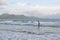 FLORIANOPOLIS, BRAZIL - JANUARY 22, 2023 : a boy is surfing on the beach Barra da Lagoa in Florianopolis