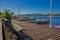 FLORIANOPOLIS, BRAZIL - MAY 08, 2016: some benches on the top of the dock close to some boats parked and a nice view of