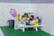 Florianopolis, Brazil. September 19, 2020: Minifigure of a boy lying on a stretcher crying for an injection. Nurse distracting the