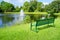 Florida lake and green bench