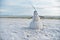 Florida snowman made out of sand celebrating tropical hot and happy new year