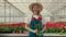 Florist African American woman portrait, flower shop. Greenhouse worker smiling, happy botanist close-up, small business