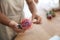 Florist with beautiful leucospermum flower in workshop