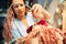 Florist decorates flower bouquet in shop closeup