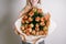Florist girl with peony flowers or orange tulips Young woman flower bouquet for birthday mother\'s day.