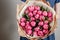 Florist girl with peony flowers or pink tulips Young woman flower bouquet for birthday mother\'s day.