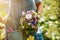 Florist holds flower bouquet in hand