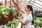 Florist inside garden greenhouse interior