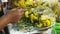 Florist makes a wreath at sri maha mariamman temple in bangkok