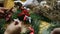 Florist making christmas door wreath.