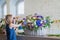 Florist making large floral basket with flowers at flower shop