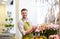 Florist man with clipboard at flower shop