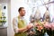 Florist man with clipboard at flower shop