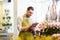 Florist man with clipboard at flower shop