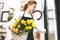 Florist takes flowers out of the fridge. Flower seller chooses flowers for future bouquet