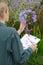 Florist woman with clipboard at flower shop