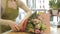 Florist woman with flowers and man at flower shop