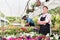 Florist woman posing in glasshouse