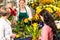 Florist woman preparing bouquet customers flower shop