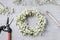 Florist at work. How to make gypsophila paniculata wedding wreath, step by step