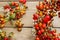 Florist at work: rose hip and hawthorn door wreath