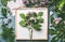 Florist work space . Flowers arrangement with green branches and pink flowers