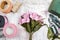 Florist at work: woman arranging bouquet of alstroemeria flowers