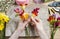 Florist at work. Woman making bouquet of spring freesia flowers