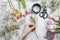 Florist at work. Woman making bouquet of spring freesia flowers