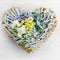 floristic composition of the heart with fresh flowers on a wooden background