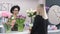 Floristic workshop. female customer makes purchase of bouquet flowers in shop.