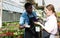 Florists discussing flowers seedlings