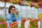 Florists woman working with flowers in a greenhouse