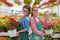 Florists women working with flowers in a greenhouse