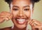 Floss, teeth and portrait of a black woman with dental, dentist and mouth wellness promotion in green studio. Young