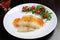 Flounder fillets in sauce with arugula and cherry tomatoes