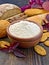 Flour amaranth in clay bowl with cookies on board