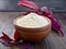 Flour amaranth in clay bowl on dark board