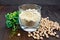 Flour chickpeas in glassful with peas on board