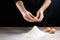 Flour and eggs, cooking dough. The recipe for cooking pizza, pasta, bread. House cooking from the chef. Dark background