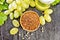 Flour grape seed in bowl on dark board top