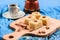 Flour halava squares with whole almonds served on indigo cloth w